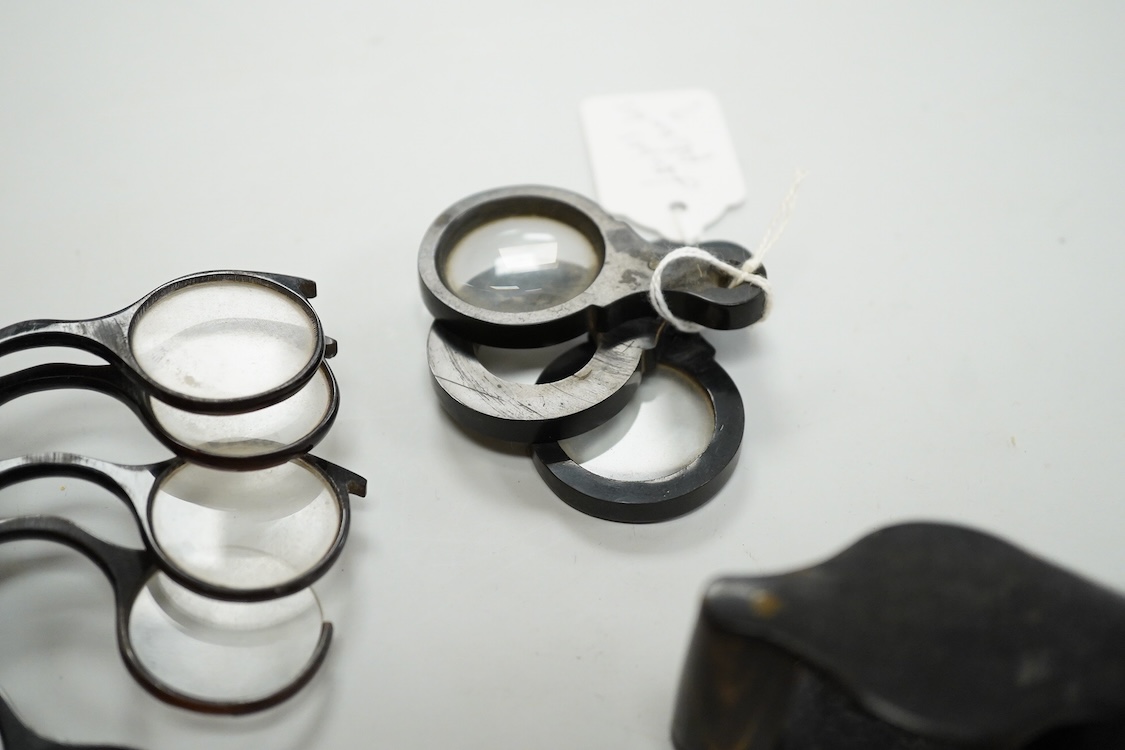 A group of 19th-century horn framed loupes, quizzing glasses and four optician multiple lens sizing lorgnettes (13)